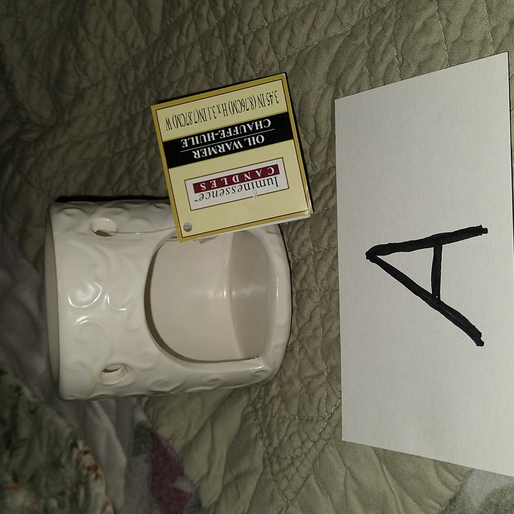 NWT Luminescence oil warmer 3.45 inches X 3.2 inch